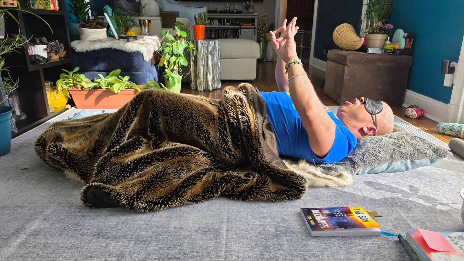 Participant resting in breathwork, wrapped in blanket