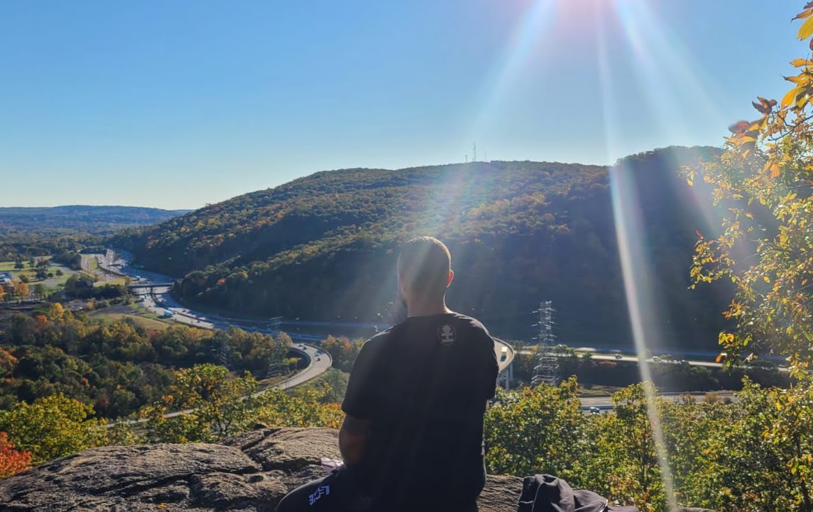 Group winter meditation by frozen lake, black and white